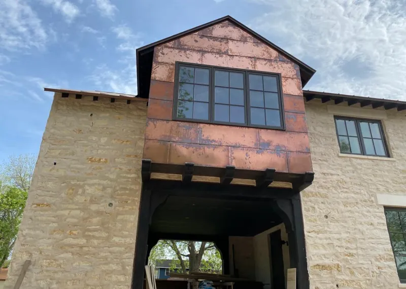 Copper metal panel facade on a stone building for Skylight Installation in Pleasant Hill