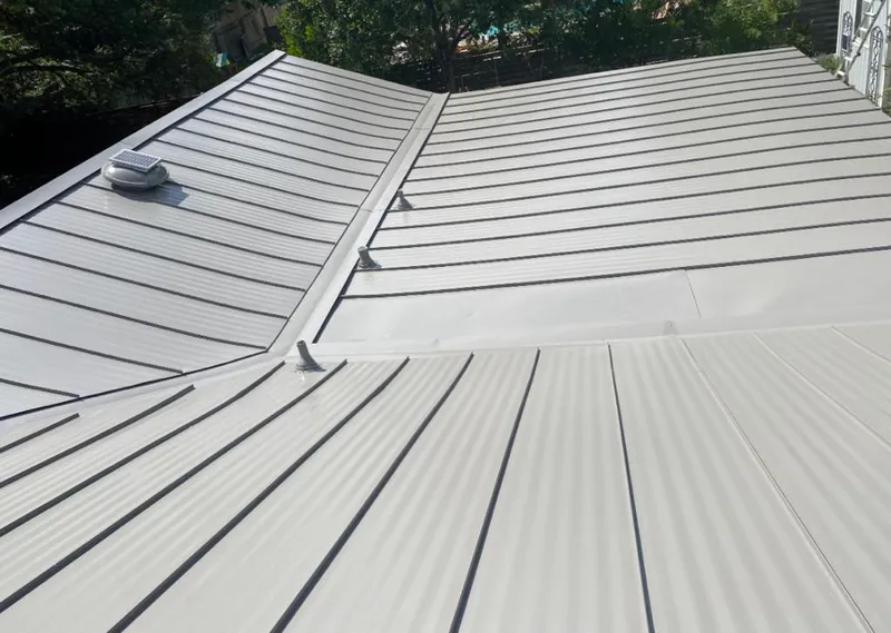 Solar attic fan installed on a metal roof for Roof Ventilation in Pleasant Hill